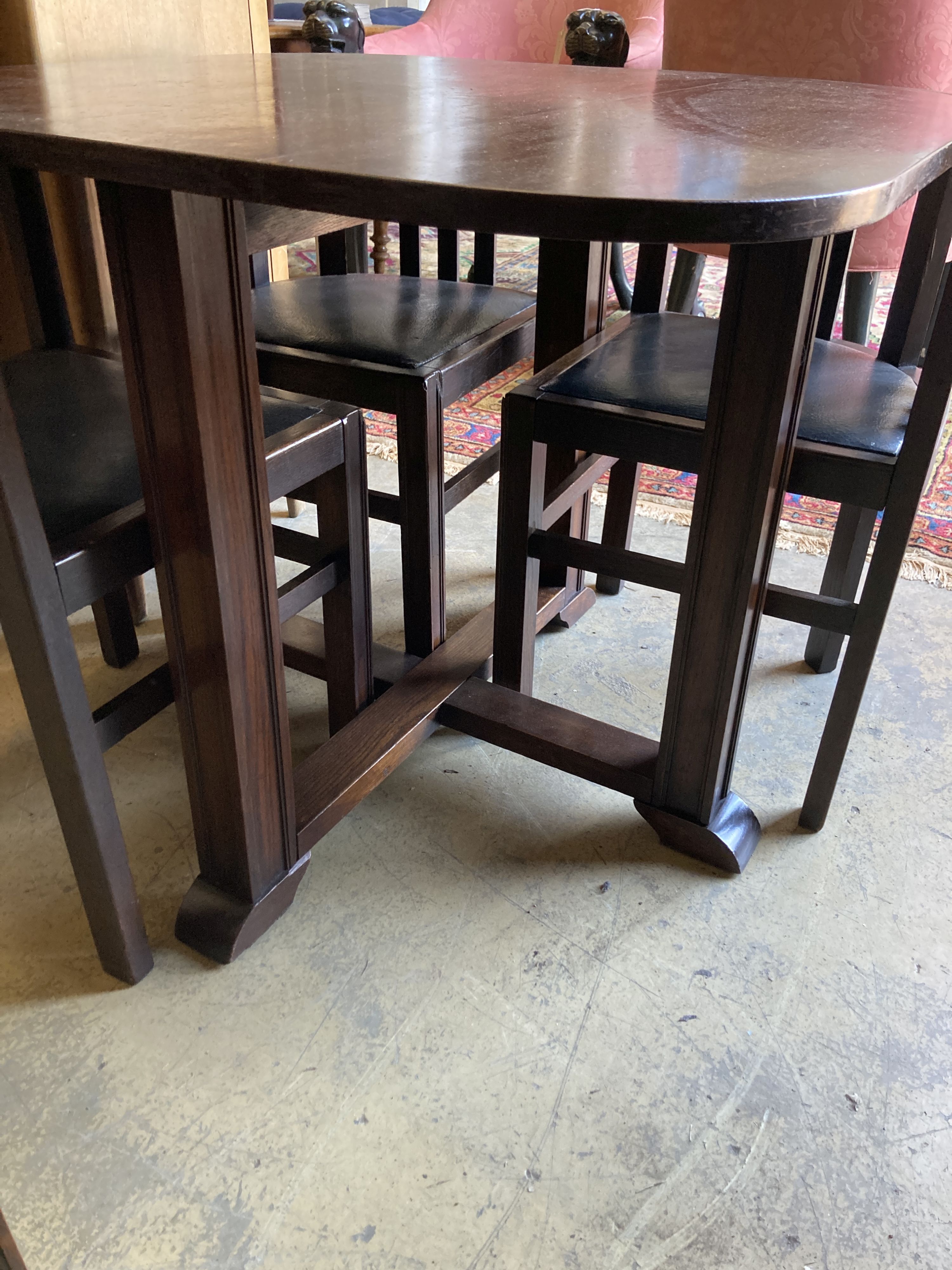 A Heals style oak table, length 92cm, depth 92cm, height 74cm and four chairs